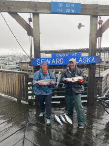 adventures for all group members posing with fish in seward alaska