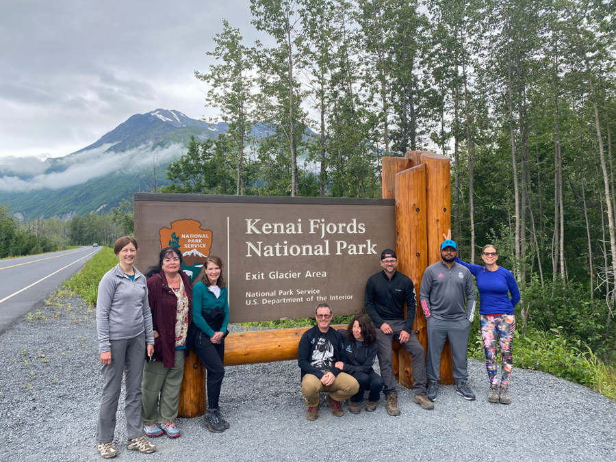 adventures for all group posting by kenai fjords national park sign