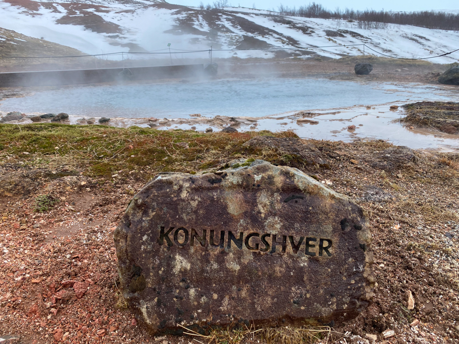 large rock in iceland with the work Konungshver carved into it