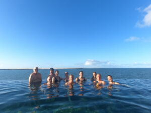adventures for all group swimming in clear ocean waters