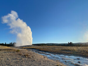 geyser erupting at yellowstone national park