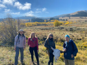 4 adventures for all group members posing with a cow skull