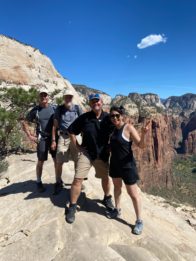 adventures for all group posing on a mountain in zion national park