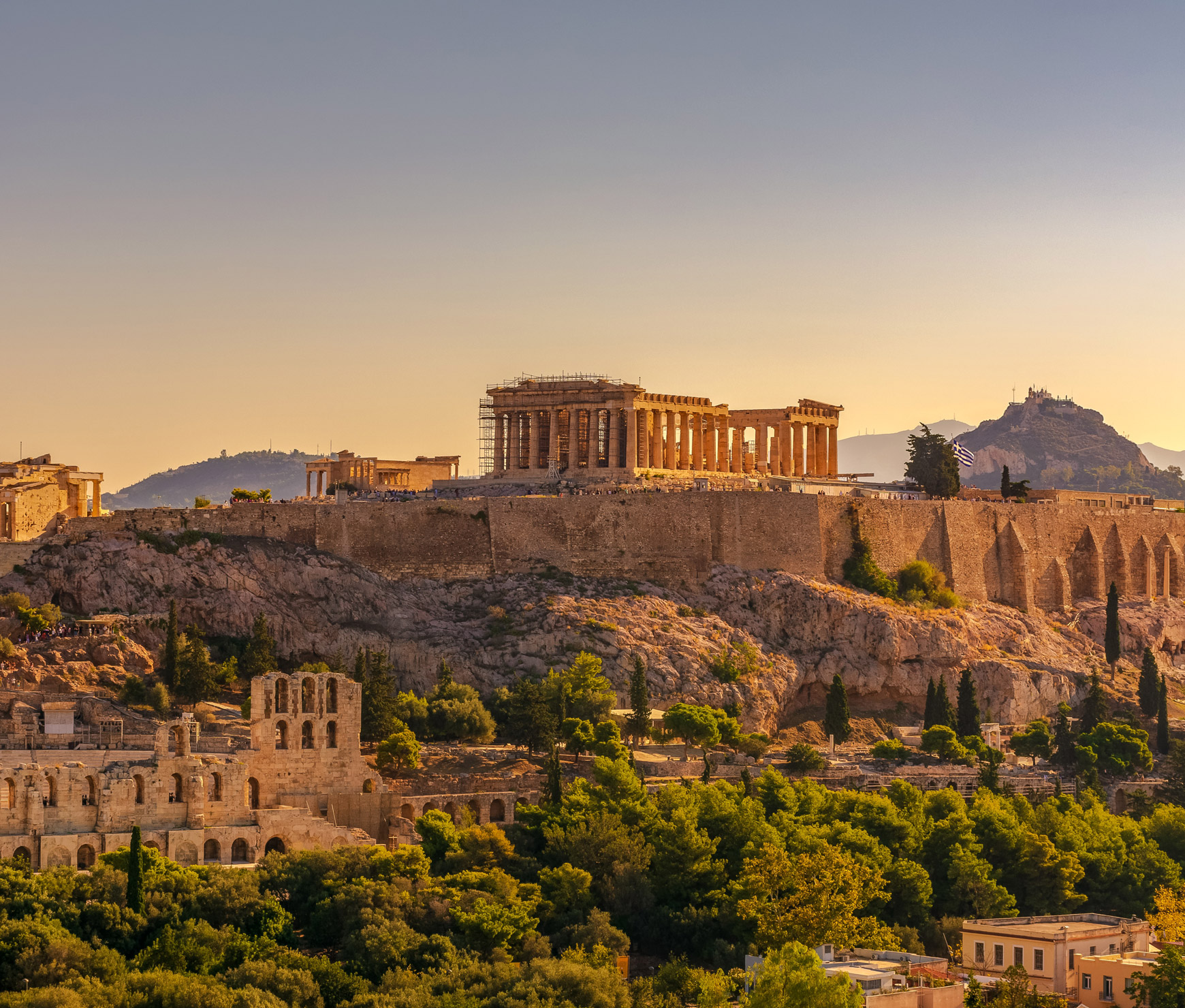 greek parthenon and old stone greek architecture during a sunset