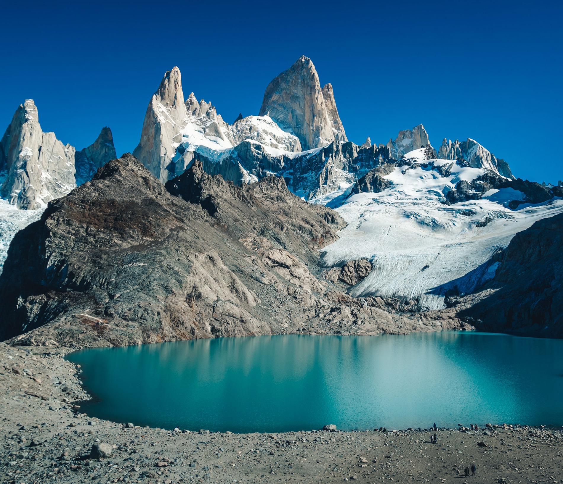 view of the patagonia mountains beside a clear lake