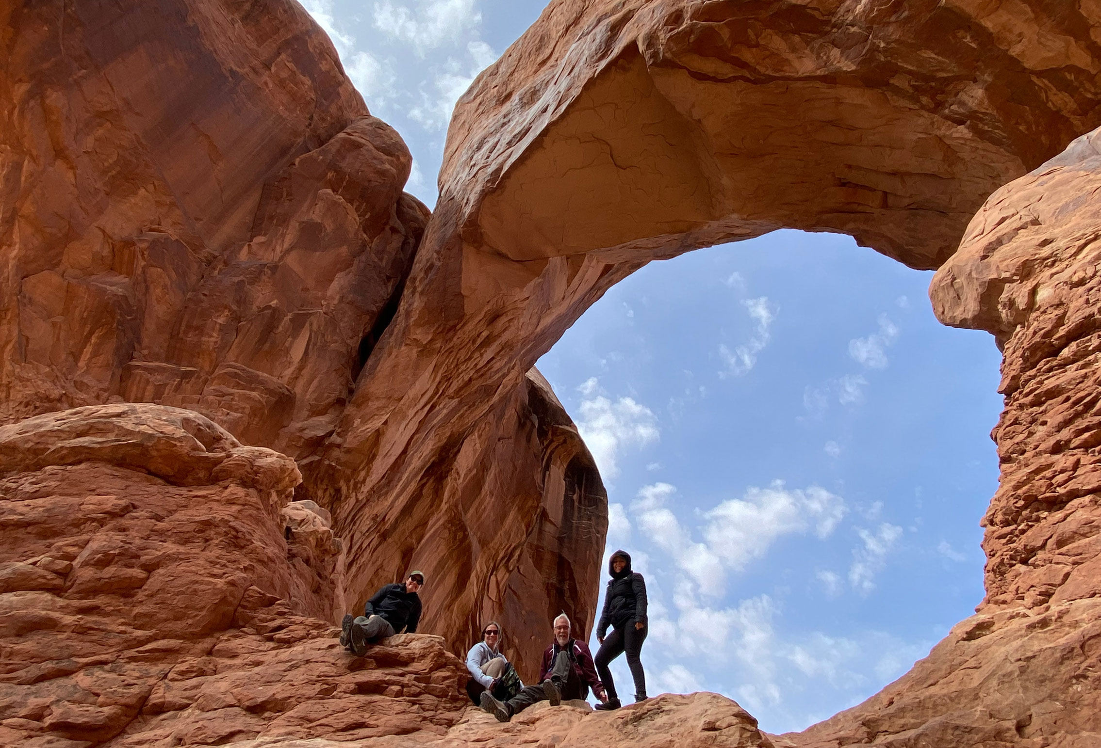 adventures for all group visiting the utah big 5 stone archway